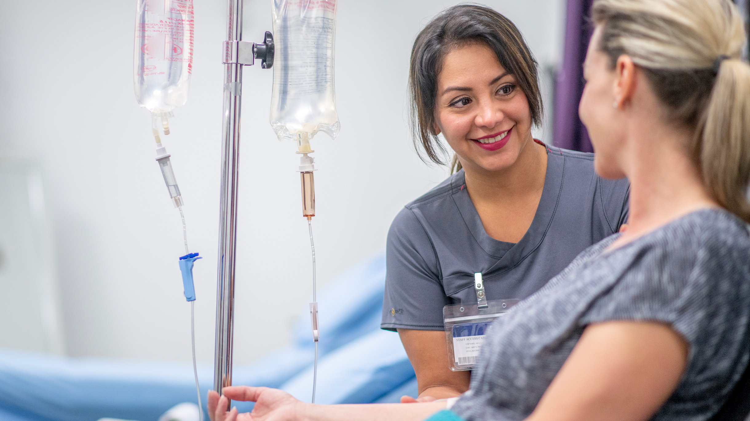 Nurse talking to a patient during infusion